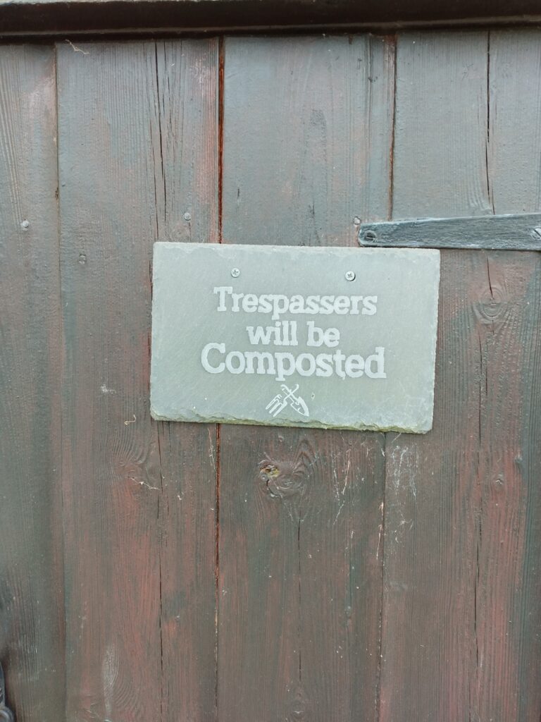 "Trespassers will be composted" sign an Slopefield allotments.